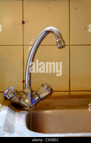 Close up of a old dirty faucet Stock Photo