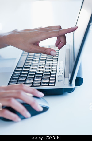 Cape Verdean woman using laptop Stock Photo