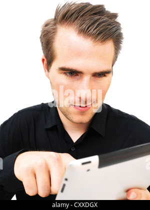 Young businessman working on an iPad Stock Photo