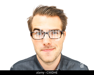 Young businessman wearing glasses, portrait, sly glance Stock Photo