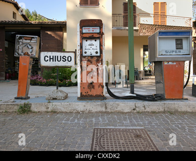 Old fuel pumps with rusty displays, abandoned petrol station in a rural area in Southern Italy, Italy, Europe Stock Photo