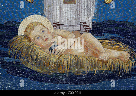 Baby Jesus lying in the manger, Christmas, wall mosaic at the Church of the Transfiguration, Mount Tabor, Galilee, Israel Stock Photo