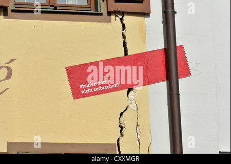 Elevation cracks in the facade of a house because of geothermal drilling that raised the ground by a few centimetres, historic Stock Photo