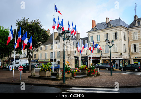 French tricolour flying in Le Blanc, Indre, France on Bastile Day, 14th July Stock Photo