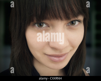 Young woman smiling, portrait Stock Photo