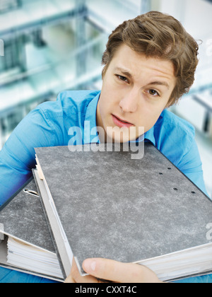 Young businessman carrying files Stock Photo
