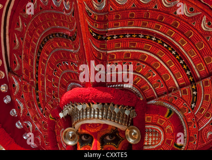 Man Dressed For Theyyam Ritual With Traditional Painting On His Face, Thalassery, India Stock Photo