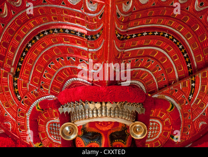 Man Dressed For Theyyam Ritual With Traditional Painting On His Face, Thalassery, India Stock Photo