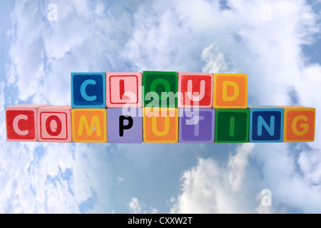 toy letters that spell cloud computing against a cloudy background with clipping path Stock Photo