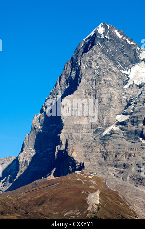 Eiger mountain, Eiger's north face in the shadow, as seen from the west, Eigergletscher station of the Jungfrau-Bahn train at Stock Photo