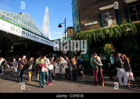 People gather outside The Market Porter pub on the corner of Borough Market, Southwark, Central London, England, UK Stock Photo