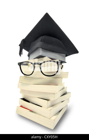 Stack of books with a graduation cap and a pair of glasses Stock Photo