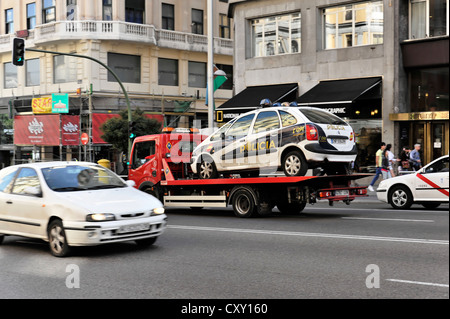 Policia, police car on a tow truck, city centre, Madrid, Spain, Europe Stock Photo