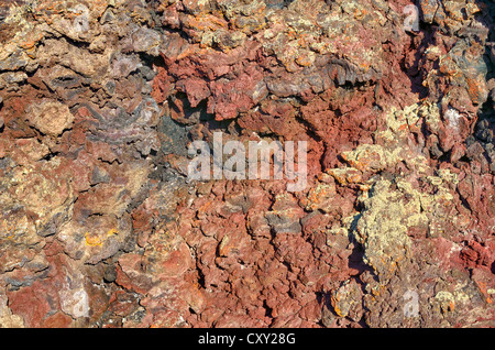 Volcanic rock, coloured by metallic oxides, Crates of the Moon National Monument, Arco, Highway 20, Idaho, USA Stock Photo