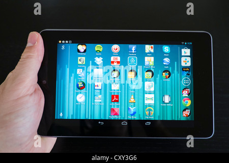 Man holding Google Nexus 7 tablet computer running android operating system Stock Photo