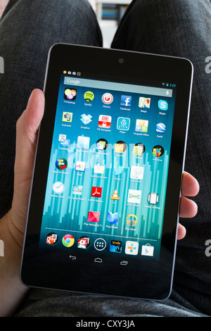 Man holding Google Nexus 7 tablet computer running android operating system Stock Photo