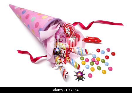 Pink schultuete or school cone with sweets spilling out Stock Photo