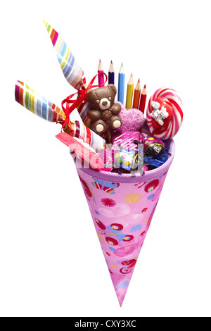 Pink schultuete or school cone filled with gifts and sweets Stock Photo
