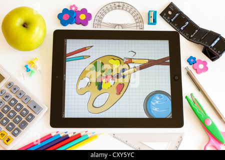 Paint on Ipad 3 with school accesories on white background Stock Photo