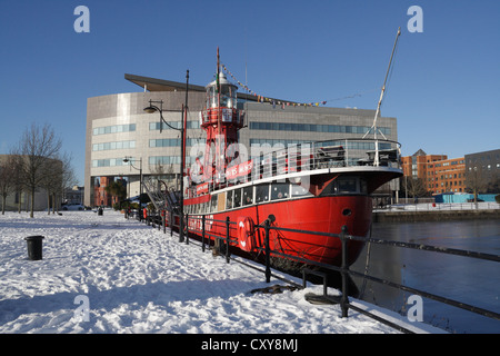 A cold snowy day in Cardiff Bay Wales. Lightship at quayside Stock Photo