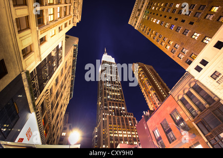 NEW YORK CITY - SEPT 13: Landmark Empire State and surrounding buildings in midtown Manhattan on night of Sept. 13, 2012. Stock Photo