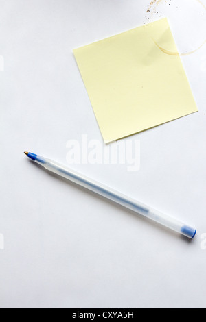 pen, paper, sticky note, coffee stain Stock Photo