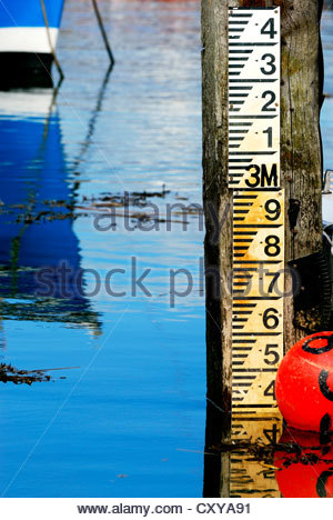 Sea tide depth measure / water level gauge on beach at low tide Stock ...