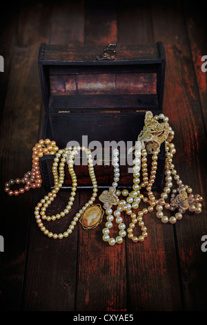 a treasure chest full of jewelry Stock Photo