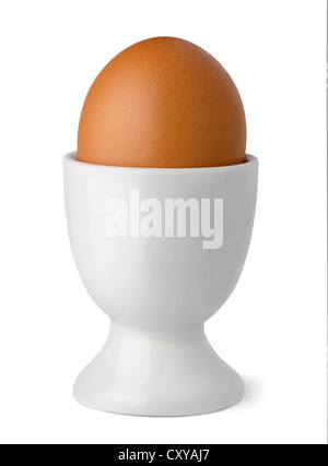 Brown egg in egg cup isolated on white Stock Photo