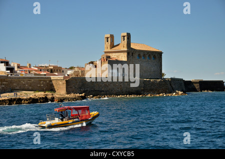 Boat in the harbour of the Island of Tabarca, church Iglesia de San Pedro at back, Isla de Tabarca, Costa Blanca, Spain, Europe Stock Photo