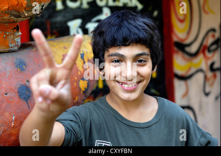 Young person making the 'victory' sign, Buenos Aires, Argentina, South America Stock Photo