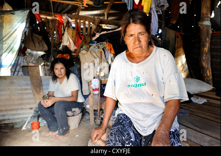 Indigene women sitting in her simple hut, village of the indigenous Wichi people, Comunidad Tres Pocos, Formosa province Stock Photo