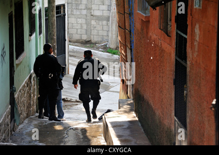 Heavily armed police units patrolling in the poor neighborhood of El Esfuerzo, the district is controlled by rivalling gangs of Stock Photo