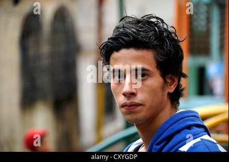Young man, 18 years old, a former hired killer and member of a gang of youths, Mara, in his former district, El Esfuerzo slums Stock Photo