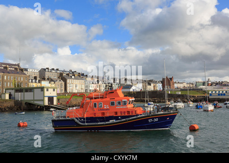 RNLI Lifeboat station and RNLB William Gordon Burr moored in harbour at Portrush, Co Antrim, Northern Ireland, UK Stock Photo