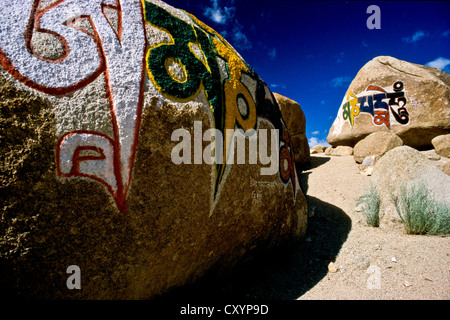 Om mani padme hum, the Buddhist mantra of compassion, painted on stone, Thiksey, Jammu and Kashmir, India, Asia Stock Photo