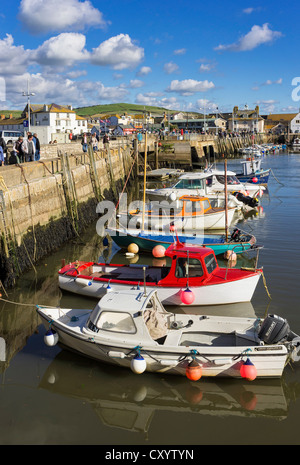 Boats in the harbour at West Bay, Dorset Stock Photo - Alamy