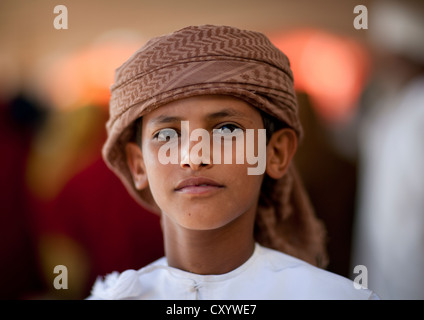 Portrait Of Bedouin Boy Wearing Turban, Sinaw, Oman Stock Photo