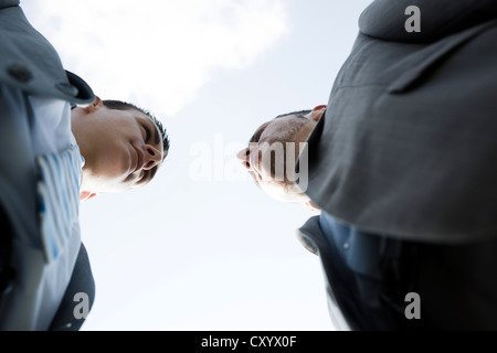 Two businessmen staring angrily at each other Stock Photo