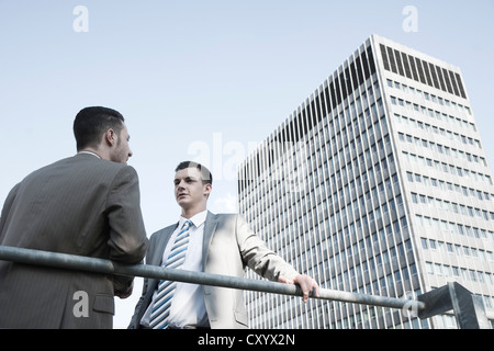 Two young businessmen in conversation Stock Photo