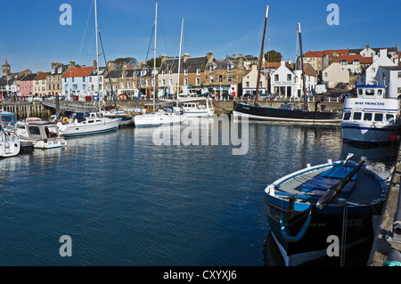 Anstruther Harbour in Fife Scotland with Fifie type fishing vessel Reaper moored near the Scottish Fisheries Museum. Stock Photo