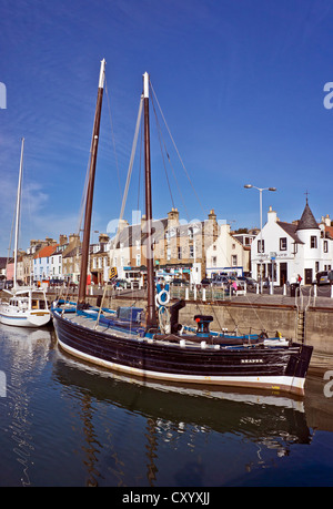 Anstruther Harbour in Fife Scotland with Fifie type fishing vessel Reaper moored near the Scottish Fisheries Museum Stock Photo