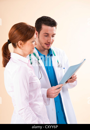 Young doctor in consultation with a patient Stock Photo