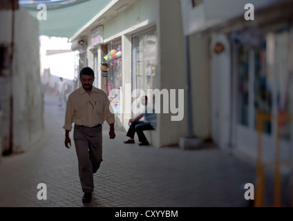 Walking Man In Muscat Muttrah Souk, Oman Stock Photo