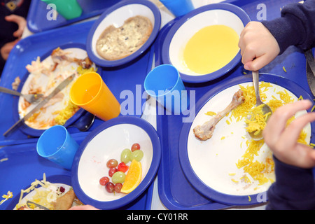 healthy school dinners served in London Primary School. Hot healthy food prepared in school kitchen. Stock Photo