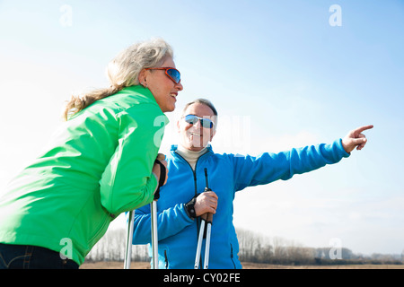 Senior couple taking a break during Nordic walking Stock Photo