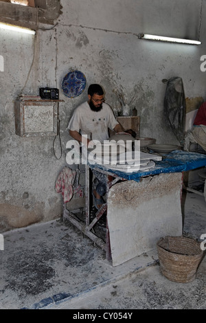 Potter working at a potter's wheel, Fes or Fez, Fès-Boulemane, Morocco, Maghreb, North Africa, Africa Stock Photo