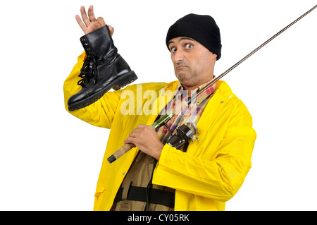 An old fisherman with a white hat is fishing with his fishing pole on the  pier of the harbor (Pesaro, Italy, Europe Stock Photo - Alamy