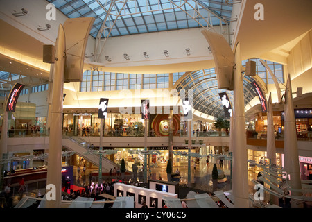 Florida, Orlando, The Mall at Millenia, shopping, atrium, escalator, man,  woman, Macy's, department store, interior, - SuperStock