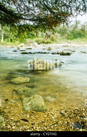 A quiet stream of the Guadalupe River runs through the Hill Country, TX. Stock Photo